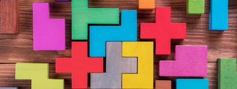 Image of coloured wooden puzzle pieces